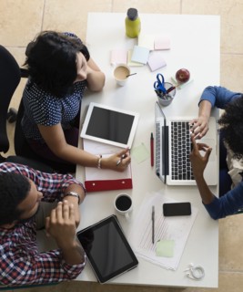 Colleagues having meeting in Small Business