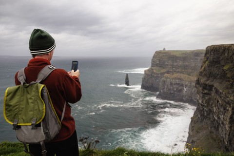Mid adult man taking photo