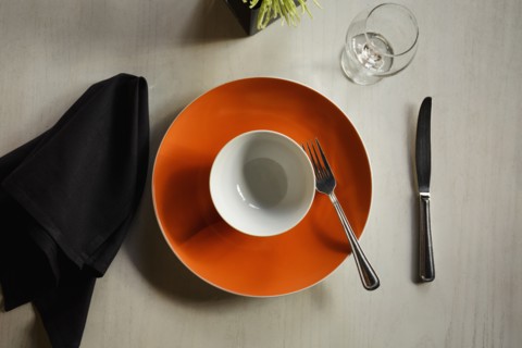 Empty plate among table setting