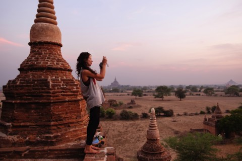 Woman taking photograph of view