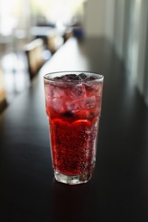 Mixed berry sparkling tea on coffee shop counter