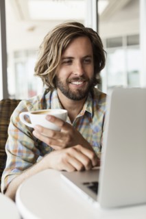 Mid adult man in coffee shop