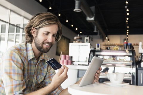 Mid adult man in coffee shop