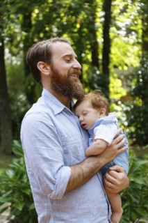Father holding baby son