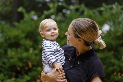 Mother holding baby girl