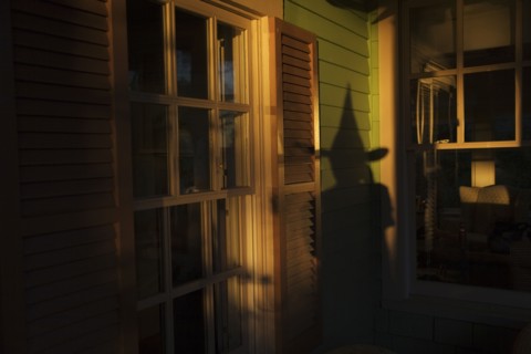 Shadow of witch on house