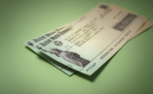 Studio shot of US government check for stimulus money