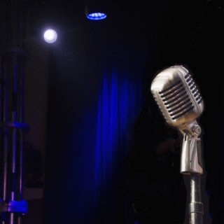 Old fashioned microphone on empty stage