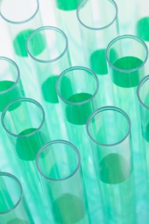 Close-up of test tubes with green liquid