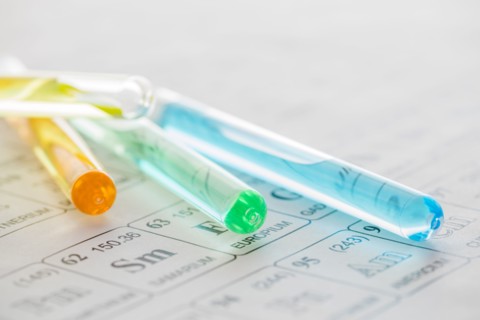 Test tubes with liquids on periodic table
