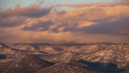 Colorful clouds at sunset over Sangre de Cristo Mountains