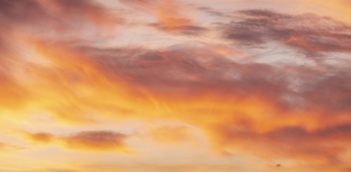 Sunset sky with golden clouds
