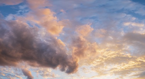 Colorful clouds on sky at sunset