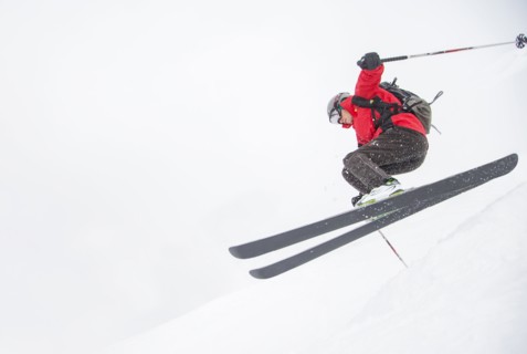 Skier jumping on snowy slope