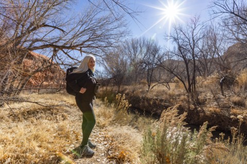 Woman hiking along Escalante River in Grand Staircase-Escalante National Monument