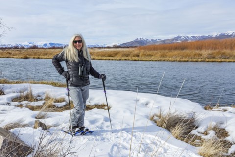 Senior woman snowshoeing at Silver Creek Preserve