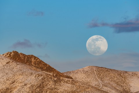 Full moon over foothills