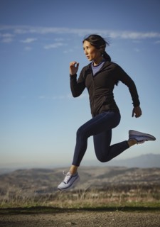 Woman jumping in landscape