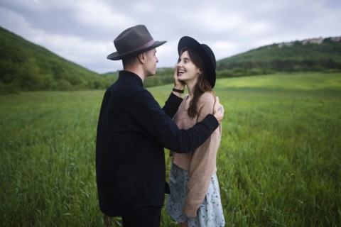Smiling young couple in wheat field