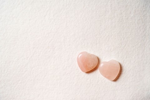Glass hearts on white background