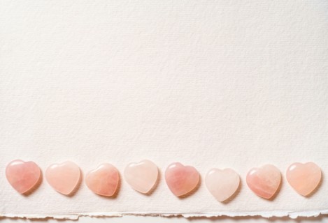 Glass hearts on white background