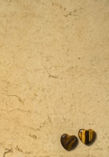 Wooden hearts on beige background