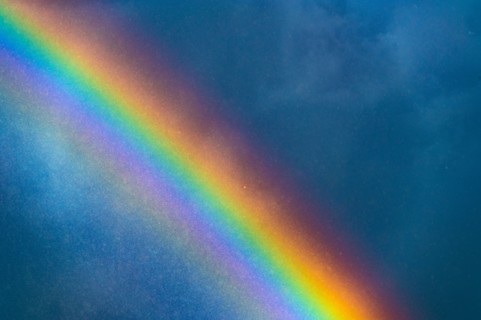 Rainbow against stormy sky