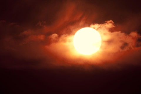 Setting sun among clouds