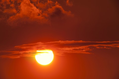 Setting sun among clouds
