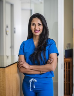Portrait of female doctor at reception desk