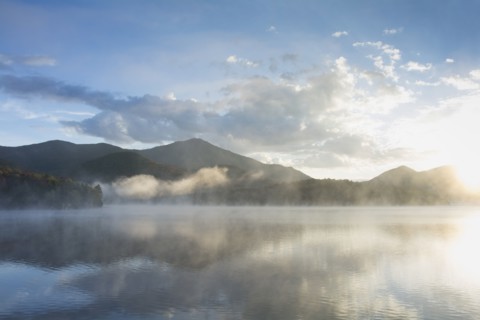 Usa, New York, Whiteface Mountain reflecting in Placid Lake