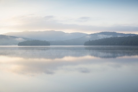 Usa, New York State, North Elba, Morning fog over Placid Lake
