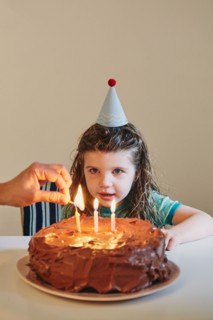 Girl celebrating her third birthday