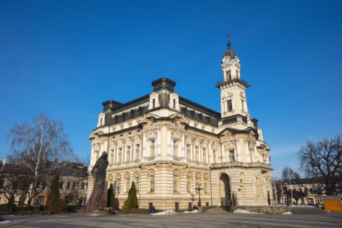 Poland, Lesser Poland, Nowy Sacz, Town hall at town square with sculptured monument