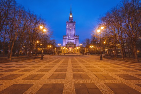 Poland, Masovia, Warsaw, Illuminated high rise building at town square