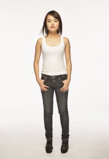 Studio portrait of woman in white tank top