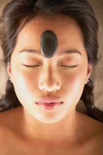 Woman with rock on forehead