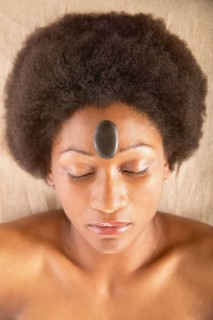 Woman with rock on forehead