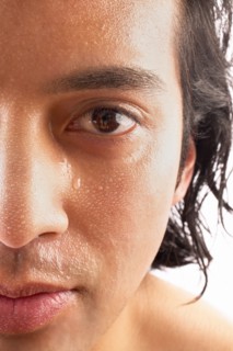 Close-up of man with water drops on face