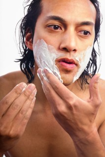 Close-up of man applying shaving cream