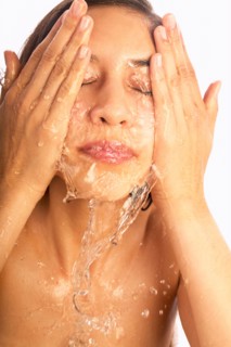 Close-up of woman washing face