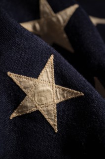 Close-up of star on retro American flag