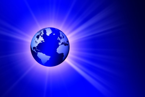 Globe on blue background with burst of light