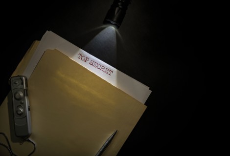 Overhead view of top secret documents on desk top