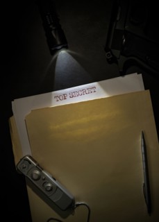 Overhead view of top secret documents on desk top