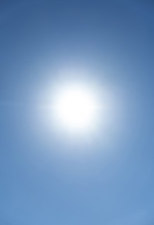 Bright sunburst in blue sky