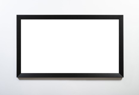 Empty black horizontal frame handing on white wall
