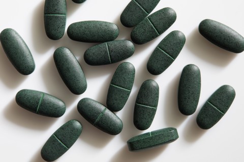 Studio shot of green pills