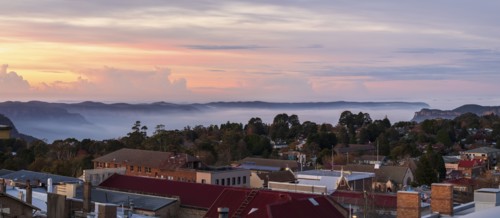 Townscape and mountains at sunset