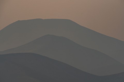 Silhouettes of layered mountains